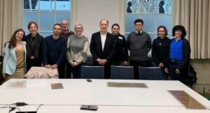 The participants of the workshop "Structuring Magic" examining magical papyri at the Leiden RMO.